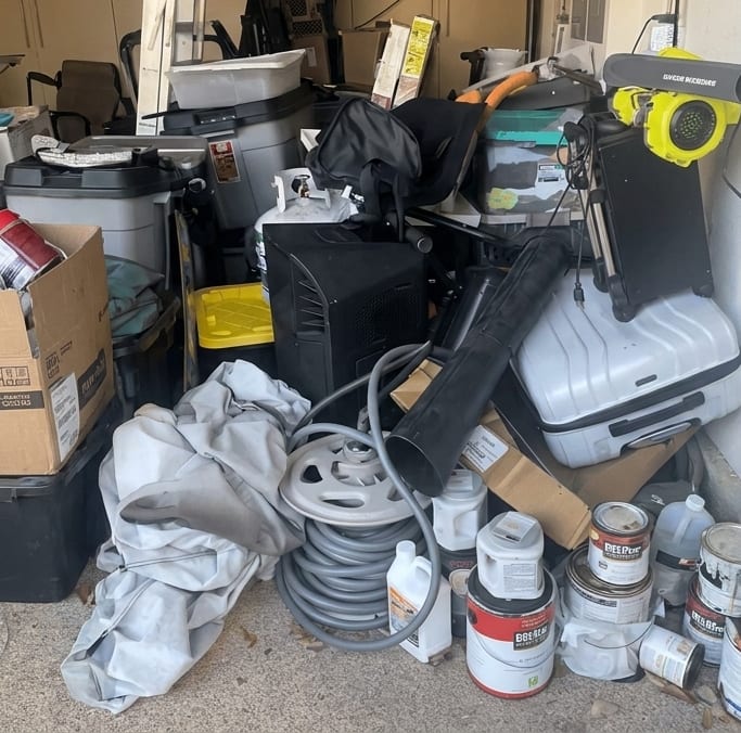 A South Florida garage packed floor to ceiling with boxes, tools and bins, with no room to walk